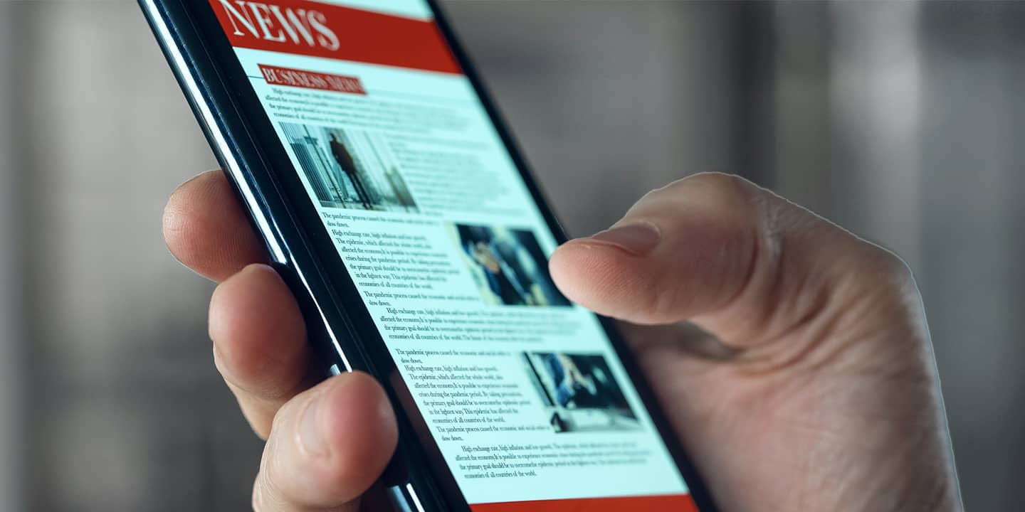 Scrolling through news feed on mobile phone